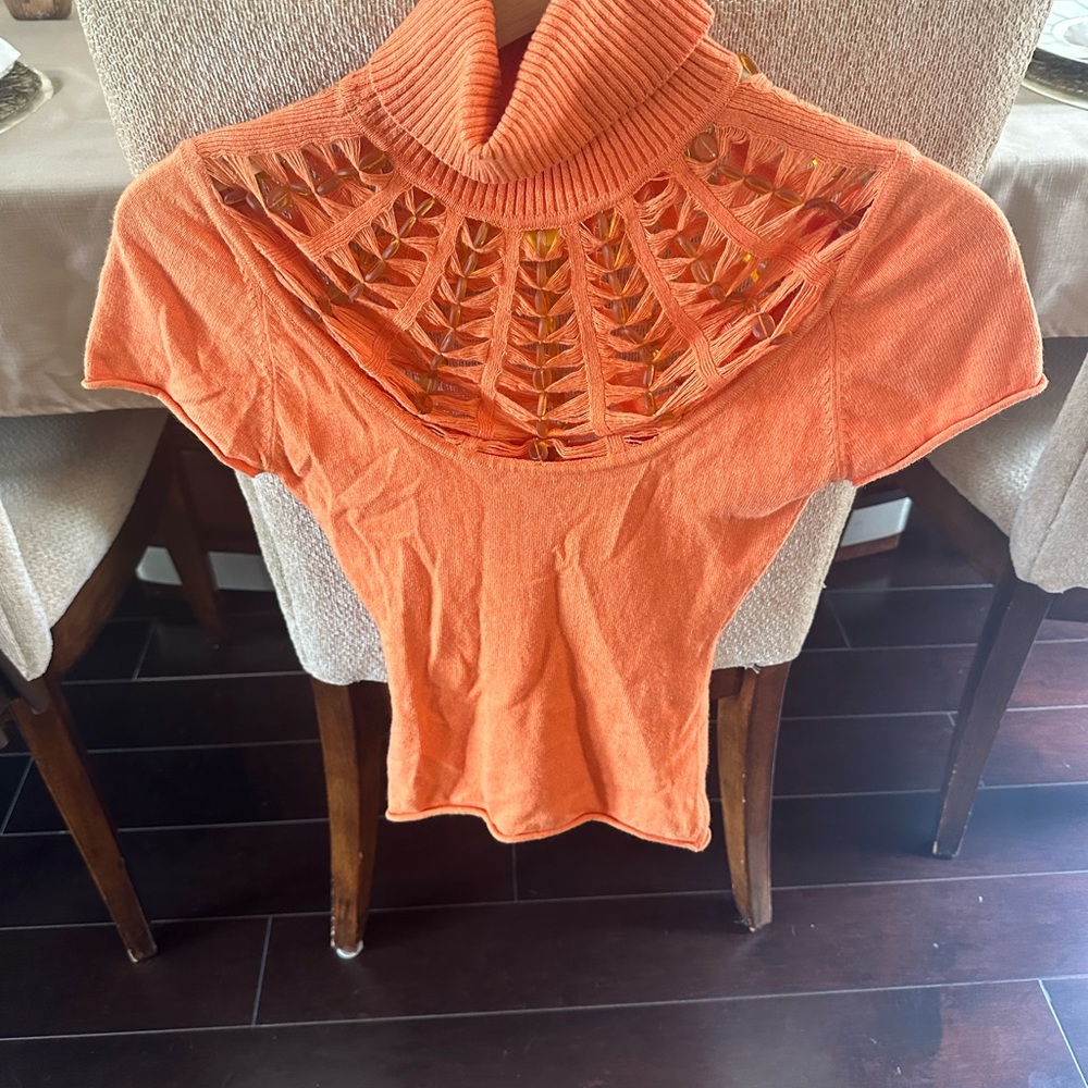 Women’s orange knit short sleeve shirt